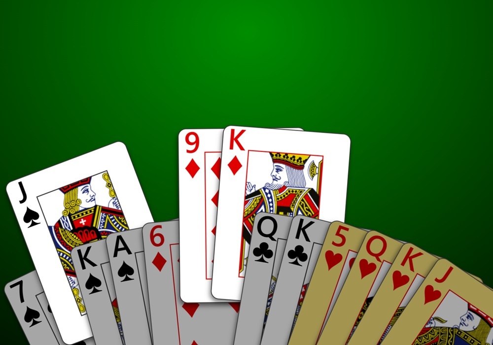 A zoomed-in screenshot of the player's hand after receiving the cards from a 3-card kitty in a game of 500 being played in Trickster Cards.