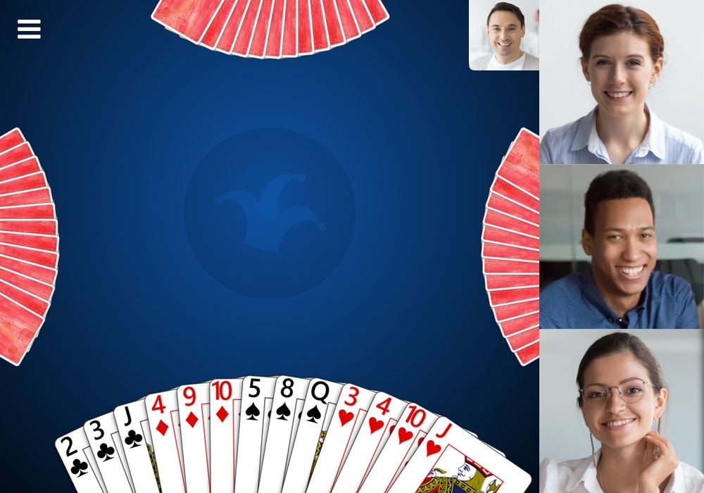 Screenshot of a game of Hearts in Trickster Cards with video chat enabled. Videos for other players are displayed to the right of the game. A video preview for the local player is displayed near the top right.